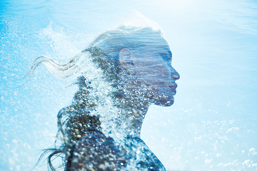 Abstract portrait of a woman blended with flowing blue water, symbolizing ionized H₂O hydration, molecular absorption, and ORY Skincare’s advanced water-phase formulation.