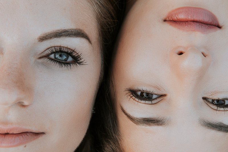 Close-up of two diverse women with natural, luminous skin tones symbolizing ORY Skincare’s inclusive beauty philosophy and commitment to skin health.