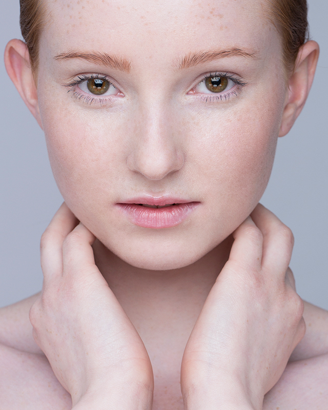 Woman with naturally sensitive skin in a soft studio portrait, representing ORY Skincare’s customized sensitive skincare routine.