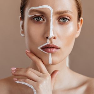 Woman with combination skin applying targeted serum treatment to T-zone and dry areas — ORY Skincare balancing serum for combination skin.”