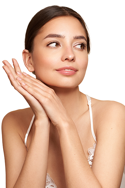 beauty_photoshoot_-serum_dry_skin Woman with smooth, hydrated complexion gently touching her face, representing ORY Skincare’s pre-formulated bi-phasic serum for dry skin designed to replenish moisture, restore comfort, and enhance skin radiance.