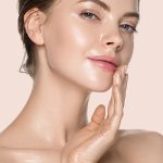 Woman with refreshed, glowing complexion applying hydrating toner for oily skin — ORY Skincare shine-control balancing toner.