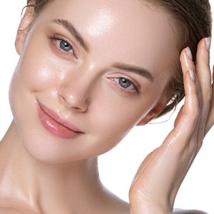 Woman with refreshed glowing complexion applying lightweight serum for oily skin — ORY Skincare mattifying and balancing serum.